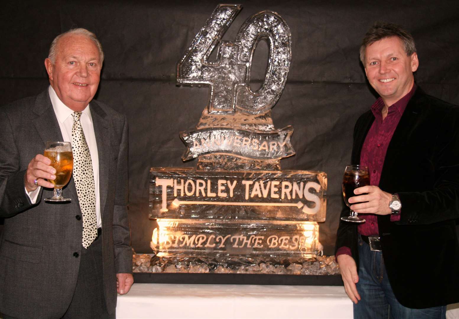 Frank Thorley and son Phil Thorley raise a glass to celebrate the 40th anniversary of Thorley Taverns in 2011