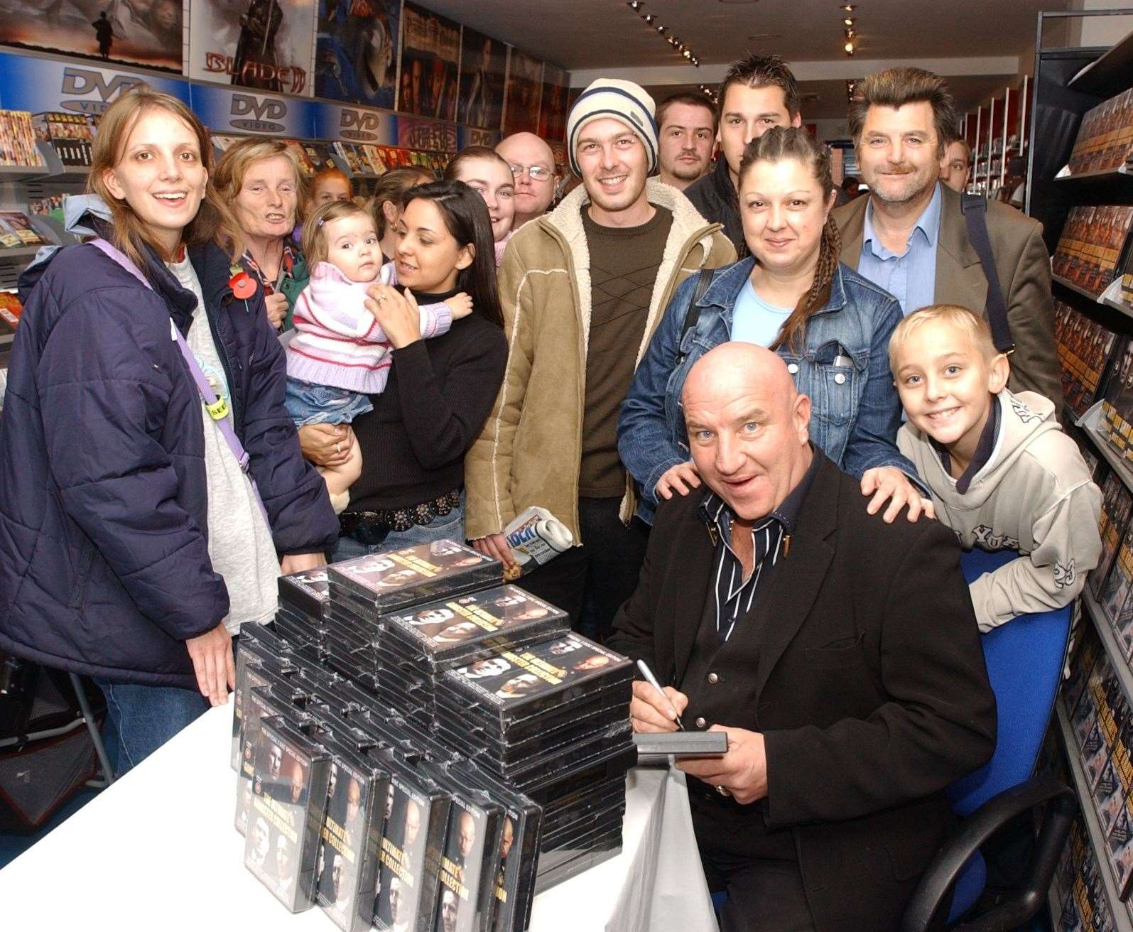 Dave Courtney signing copies of his DVD at Air Entertainment in Chatham High Street in 2005. Picture: Jim Rantell