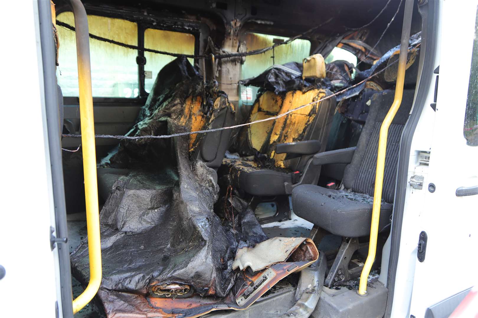 The burning Audi rolled into a minibus, which also caught fire. Pictures by Keith Thompson
