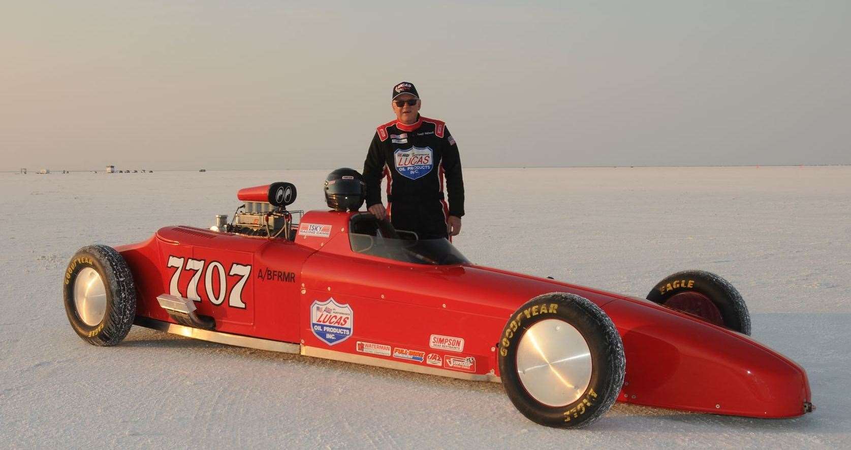 Geoff Stilwell posing with his car at the Bonneville Salt Flats. Picture: Geoff Stilwell