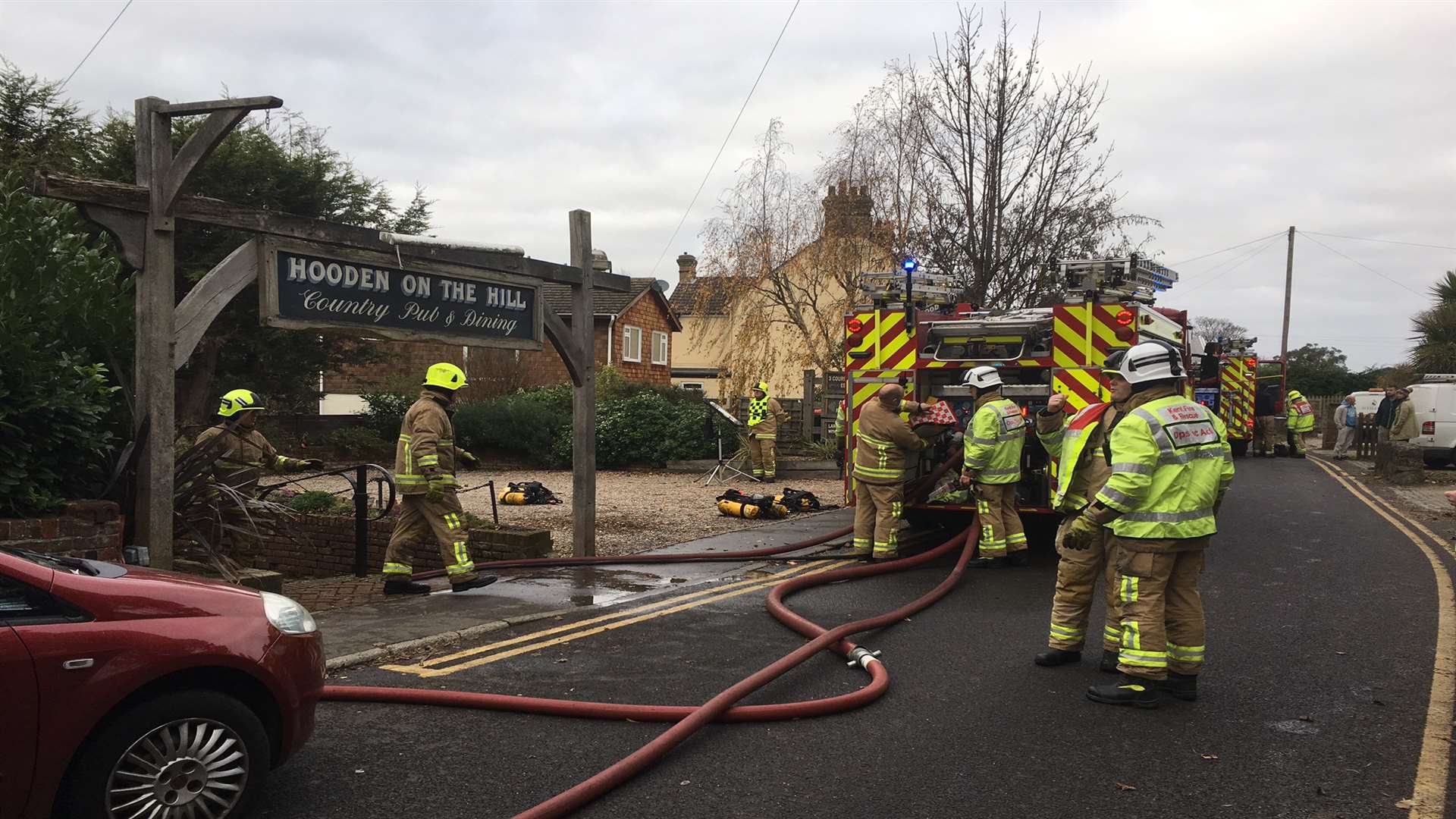 Firefighters battling the blaze at the Hooden on the Hill in Willesborough yesterday