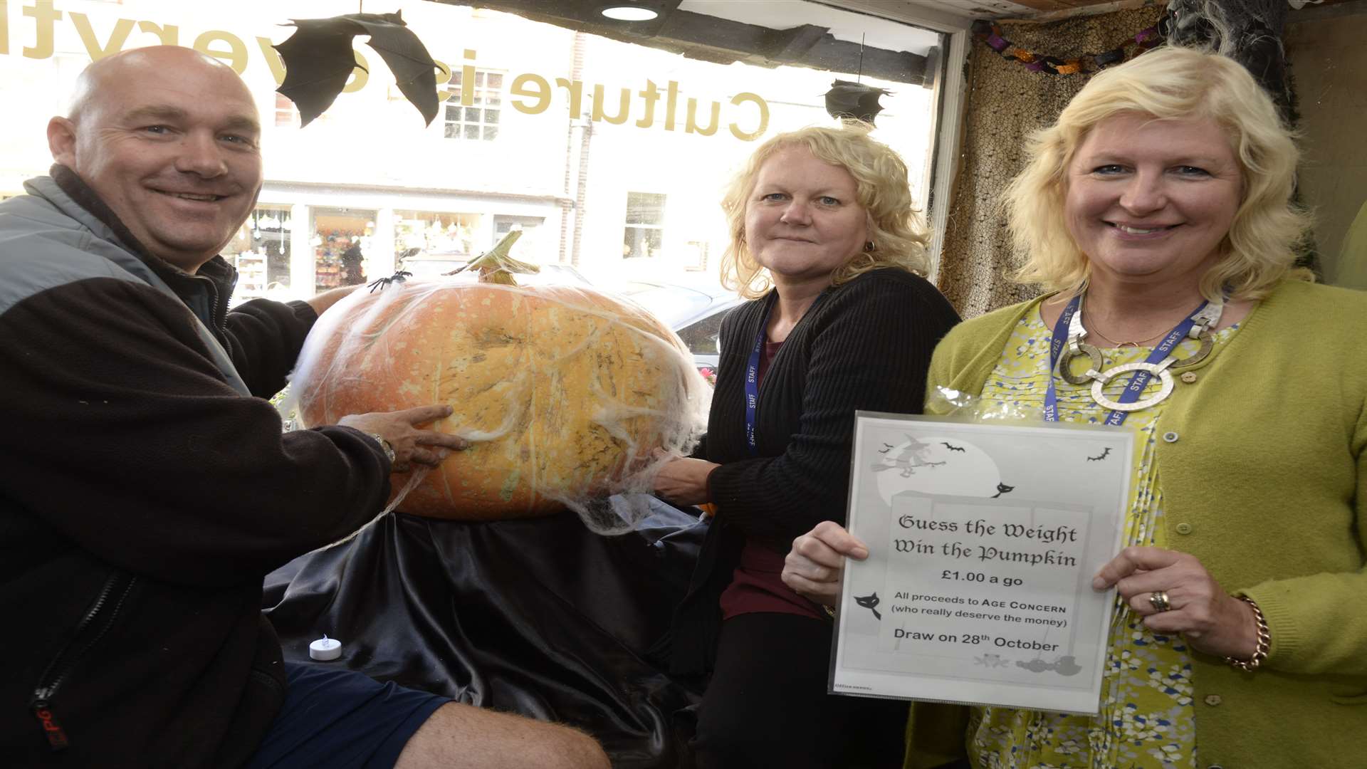 Simon with Jane Goring and Tracey Ward from Age Concern and the giant pumpkin at The Fruit Bowl in Sandwich