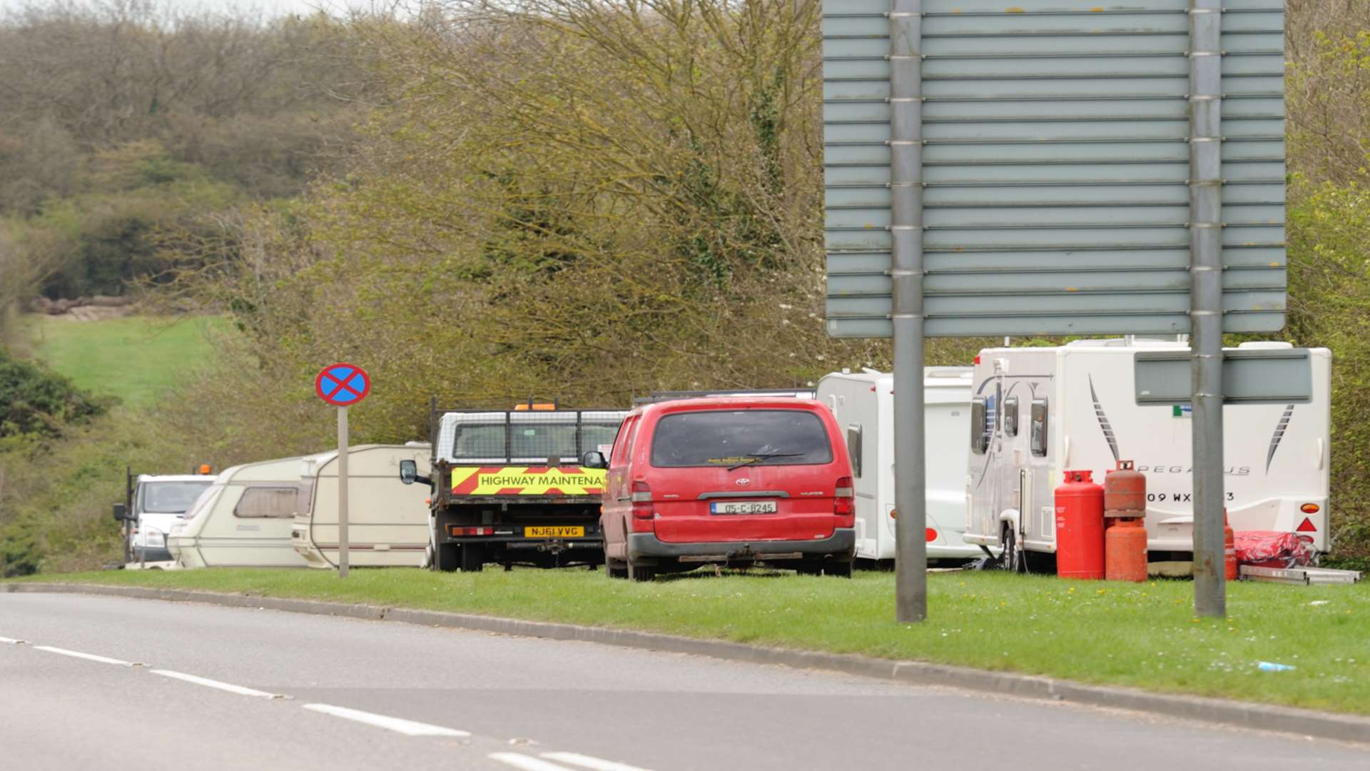 Travellers have pitched up on a grass verge near the roundabout and Darent Valley Hospital but are being moved on.