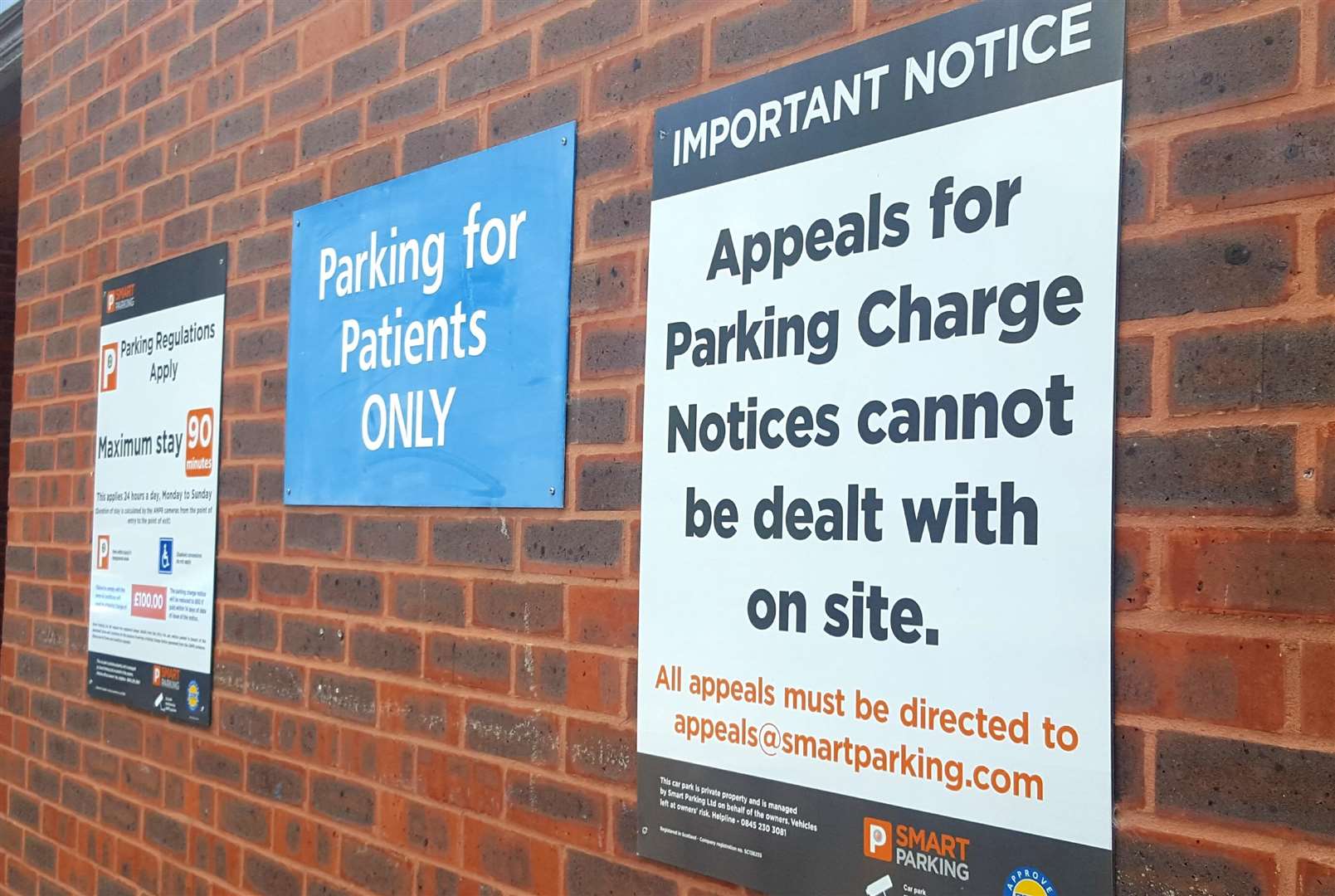 Signs at Canterbury Health Center warn about parking rules (2590822)