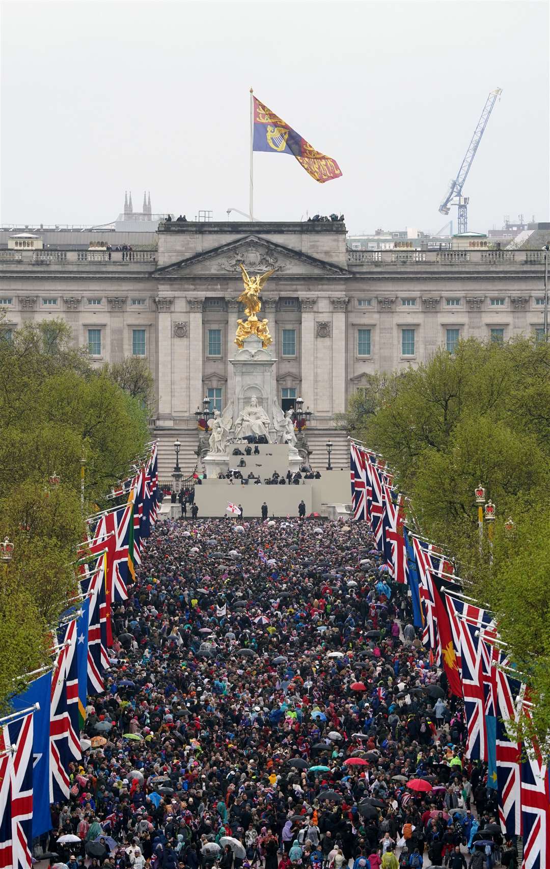 Members of the public along The Mall following the coronation ceremony of the King and Queen Camilla (Gareth Fuller/PA)