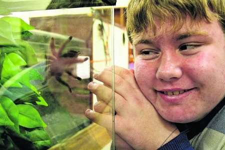 15-year-old Michael Ashfield gets friendly with the college’s Martinique Pink Toe Tarantula