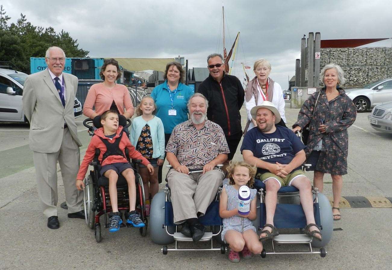 Rory Heap (seated left) and Craig Potter (seated right) with guests at the launch of the Beach Within Reach scheme in Whitstable. Pic: Canterbury City Council (14518539)