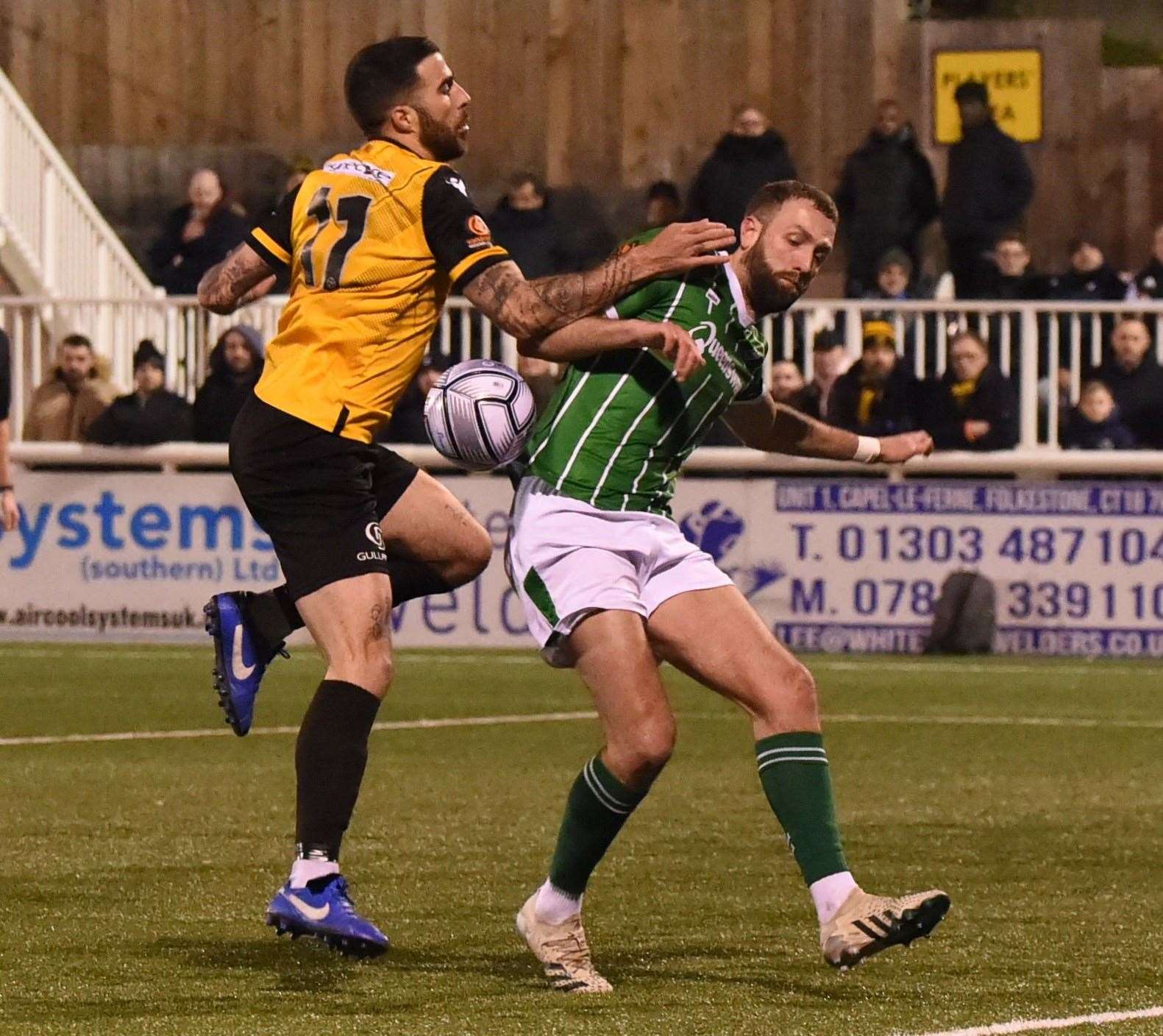Joan Luque tussles with Braintree's former Maidstone defender Luke Pennell Picture: Steve Terrell