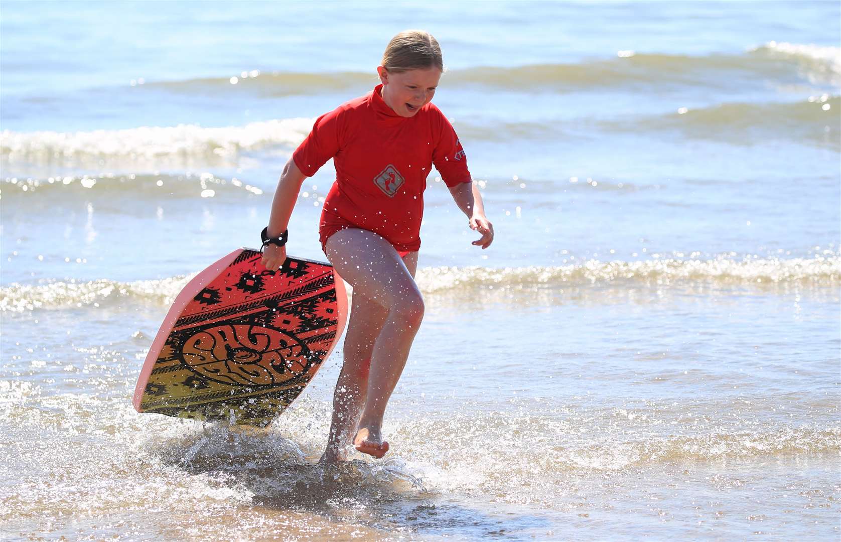 Oliva Atkins, 10, keeps cool in the sea at the East Yorkshire resort (Danny Lawson/PA)