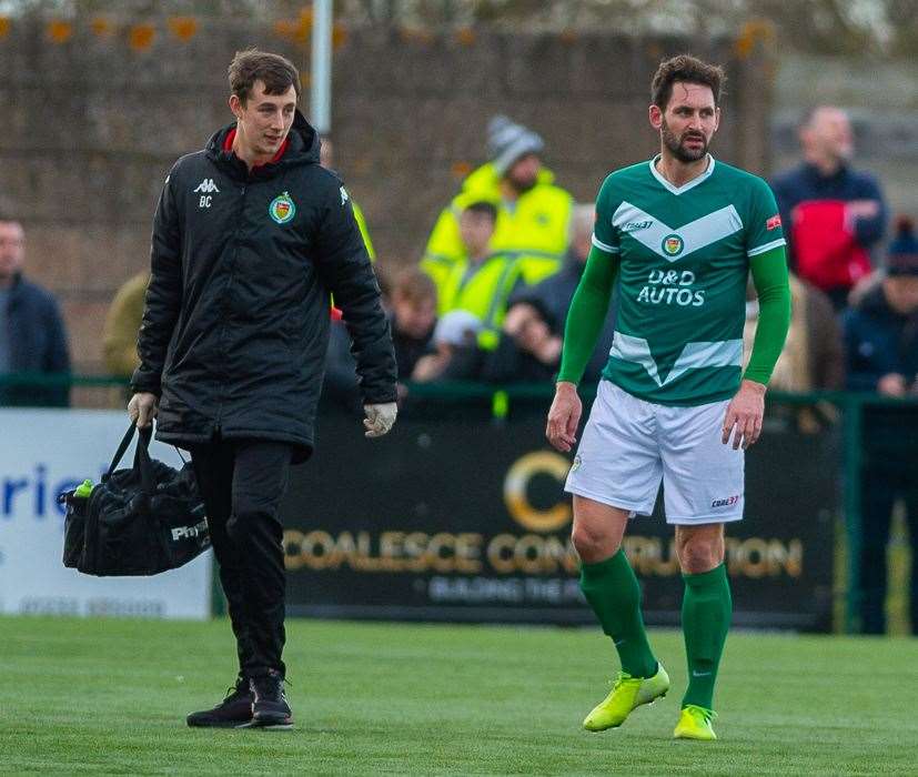 Ashford United striker Jay May goes off with a hamstring injury Picture: Ian Scammell