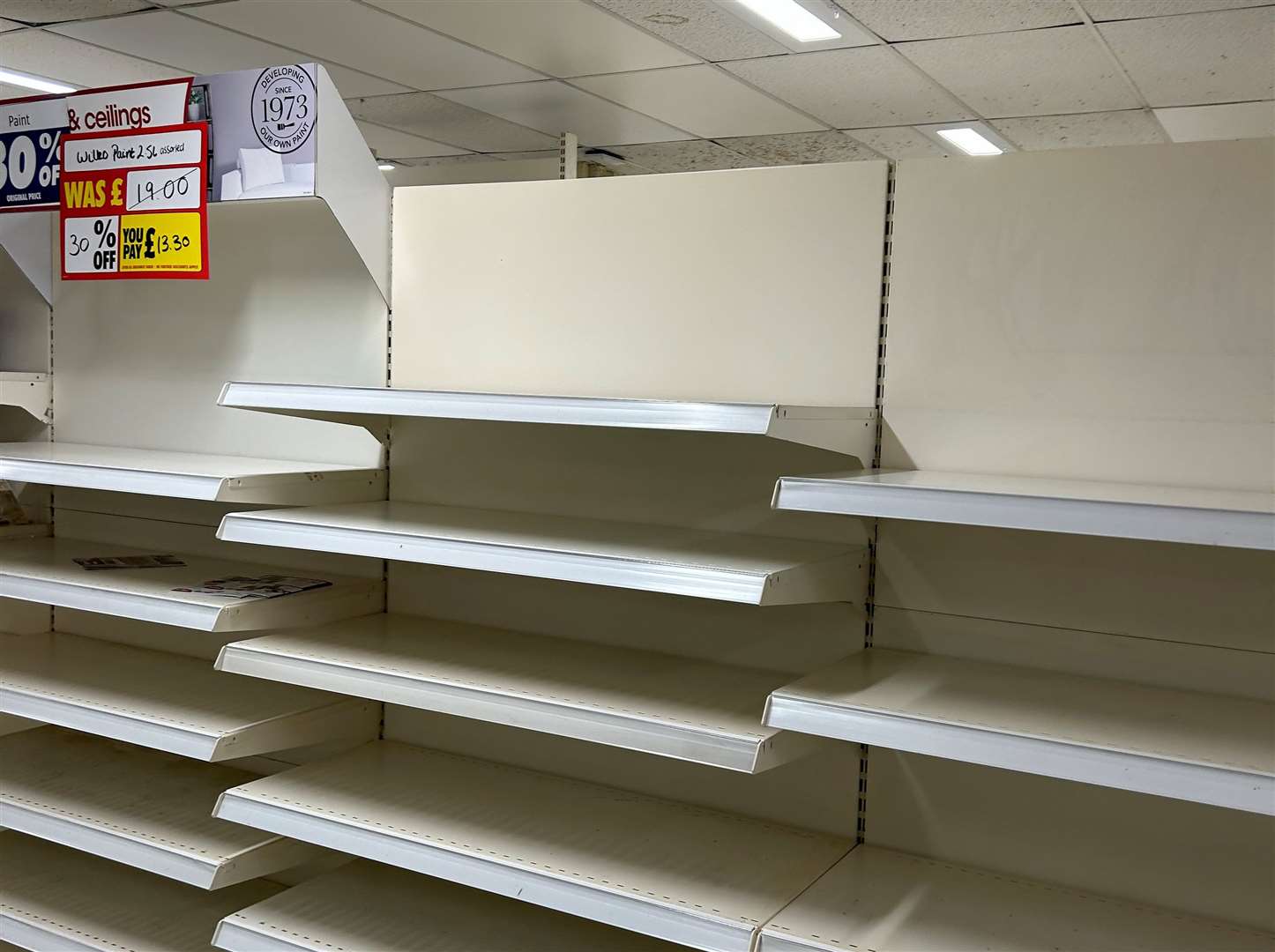 Shelves which used to be packed now empty at Wilko