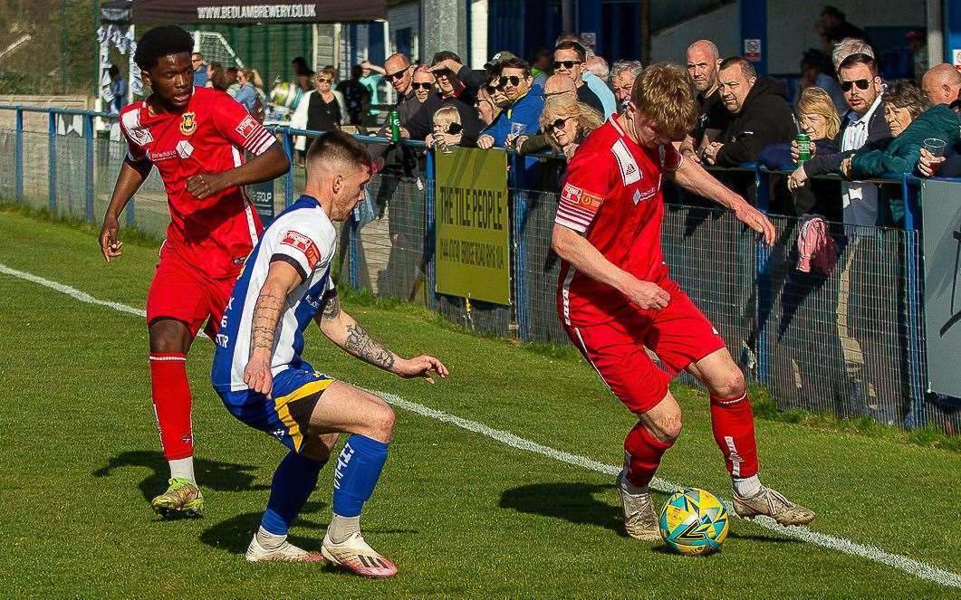 Whitstable's George McIlroy is watched by new signing Veron Nzing during their defeat at Haywards Heath. Picture: Les Biggs