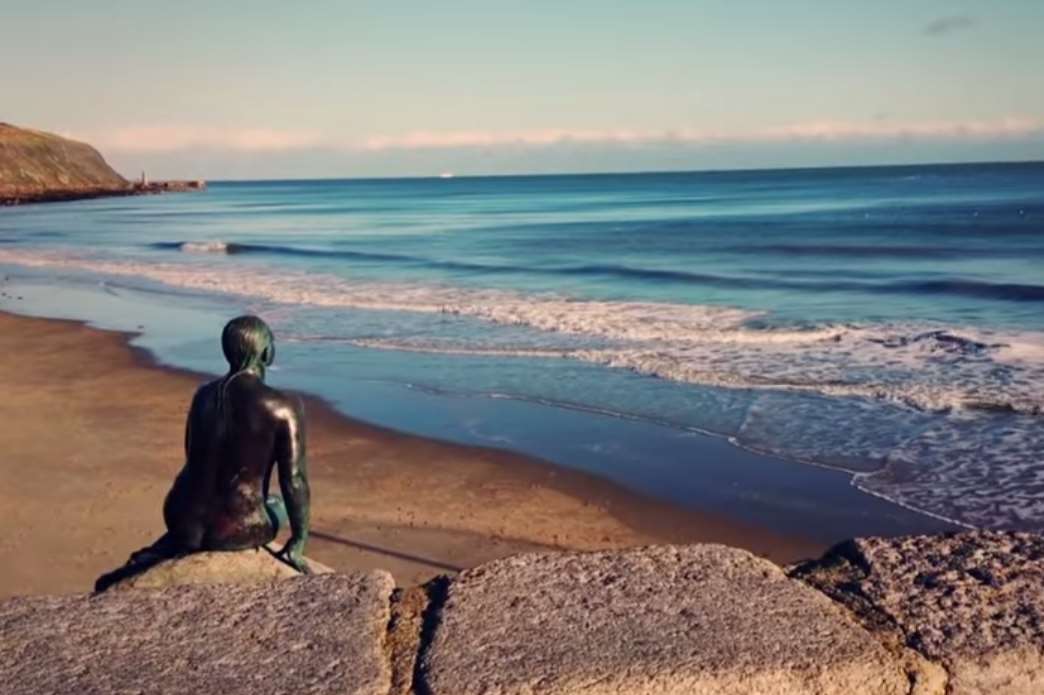 The mermaid looking out over Sunny Sands is one of the town's most iconic views