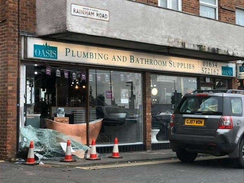 The 4X4 crashed into the Oasis Plumbing & Bathroom store on Rainham Road yesterday afternoon. Picture: Nicole Fox