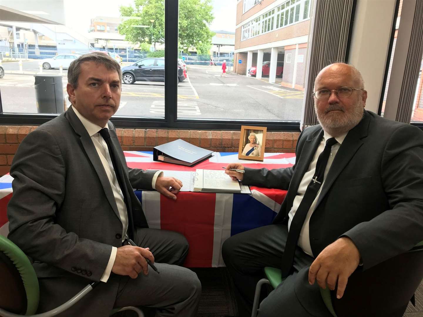 From left: Gareth Johnson MP and council leader Cllr Jeremy Kite with one of the books of condolences. Picture: Dartford Borough Council