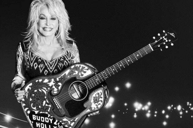 Country legend Dolly Parton with one of Alister Atkin's guitars
