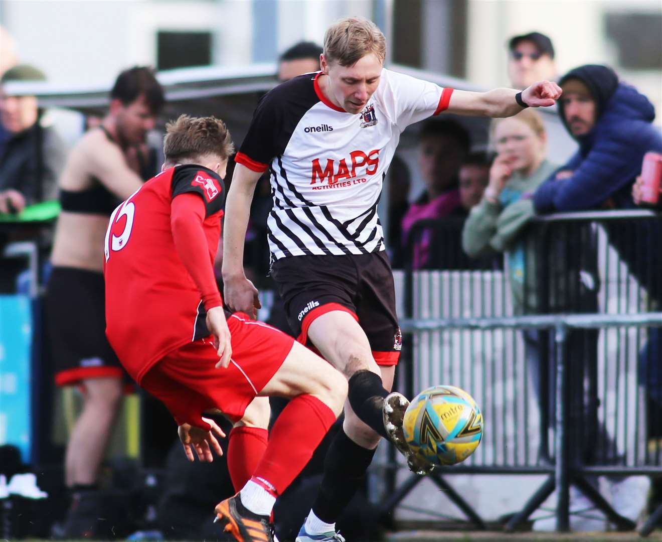 Ben Chapman of Deal and Phoenix Sports player Mikey Dalton challenge for the ball. Picture: Paul Willmott