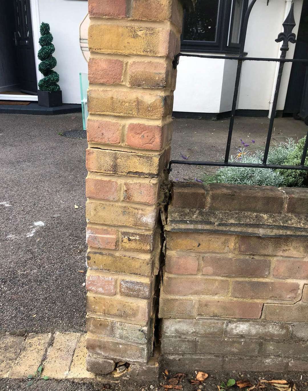 The wall outside Kelly Duncan's property in Mill Road in Sutton at Hone has been knocked by speeding drivers mounting the kerb