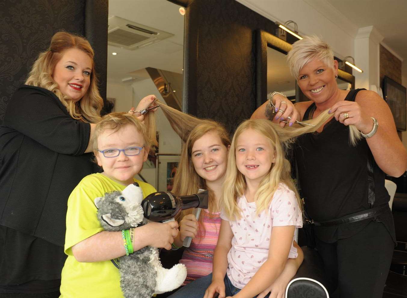 Hairdressers Rochelle Turner and Natasha Collier with Oakley, Maisie and Tilly Orange