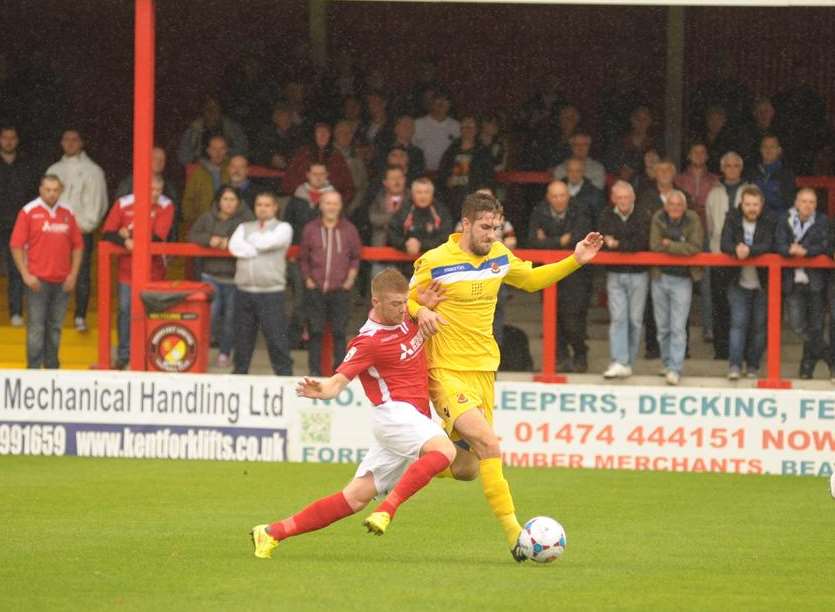 Alex Osborn makes a challenge in front of The Liam Daish Stand Picture: Steve Crispe