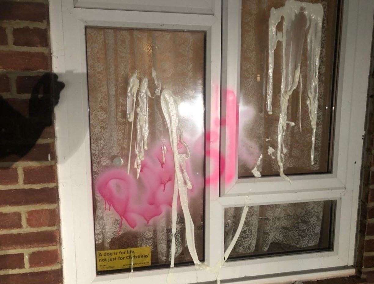 The word 'rapist' was scrawled across the window of the home. Pictures uknip
