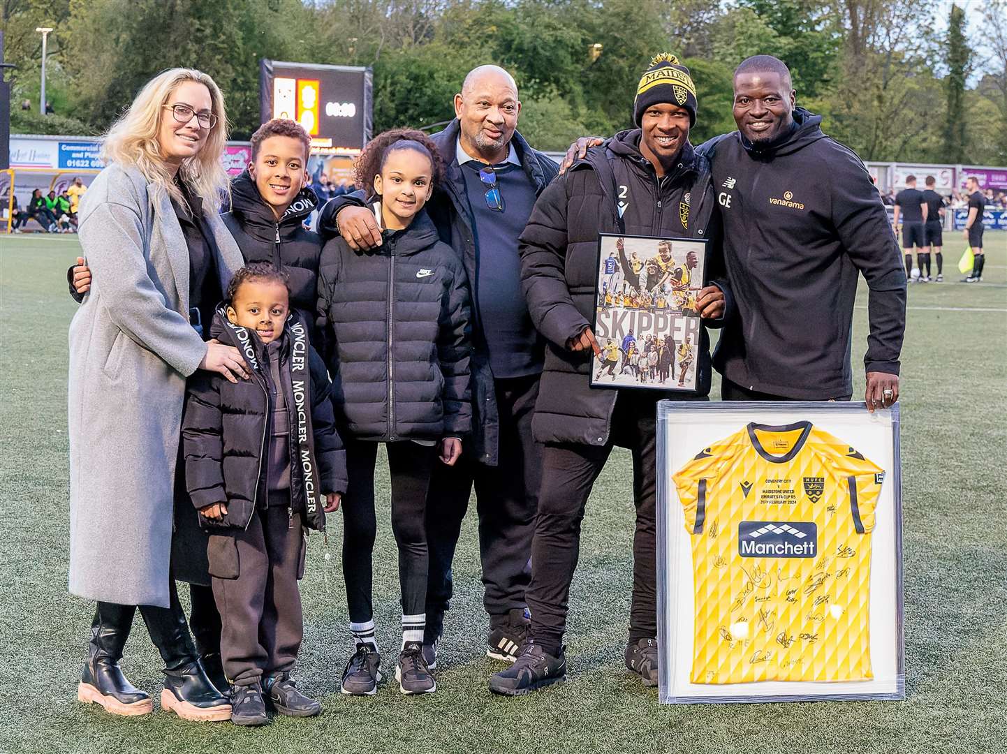 Gavin Hoyte on the pitch with his family following a presentation from manager George Elokobi to mark his five years at Maidstone Picture: Helen Cooper