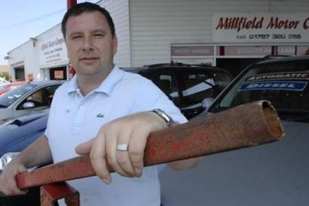 Garage owner Martin Kingham with the damaged barrier