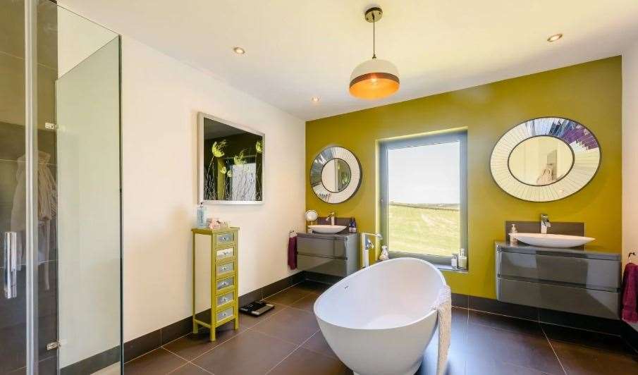 The en suite bathroom of the principal bedroom has its own freestanding bathtub. Picture: Strutt and Parker