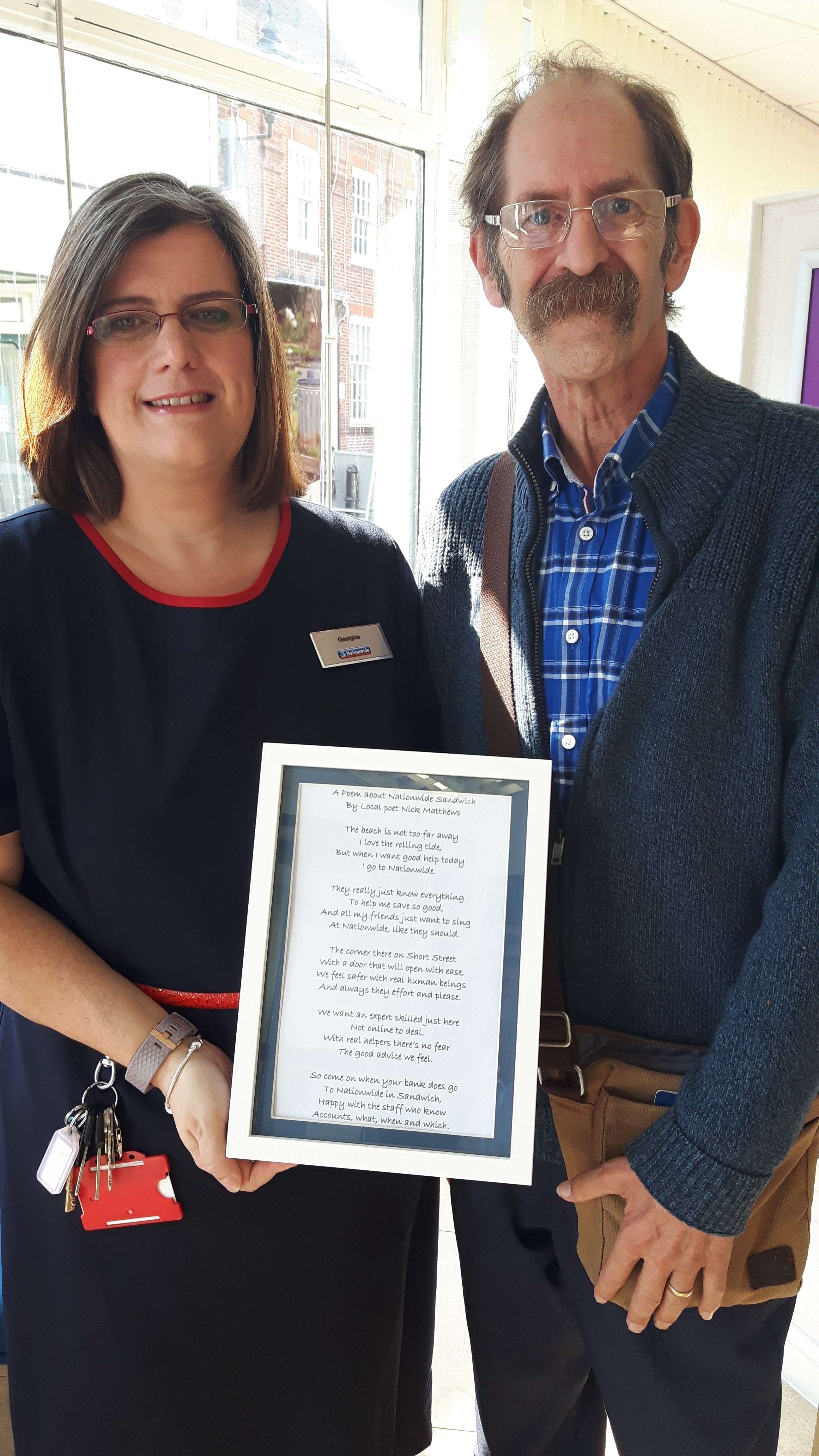 Georgina Isted from Nationwide in Sandwich with poet Nick Matthews who has donated the cash Nationwide gave him to the town's Age Concern branch