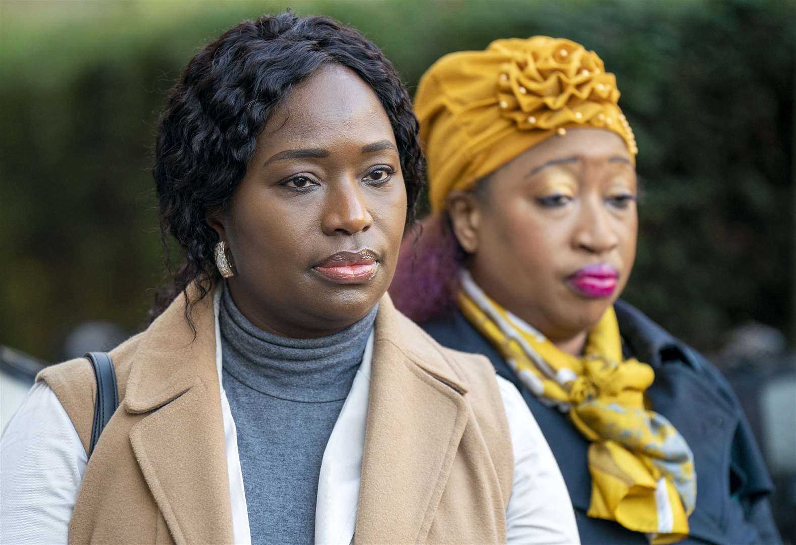Sheku Bayoh’s sisters Kadi Johnson, left, and Kosna Bayoh outside a previous hearing in the inquiry (PA)