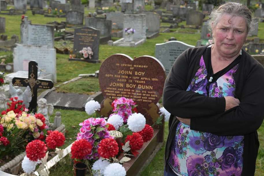 Betty Dunn at her son's damaged grave stone