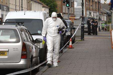 Police forensic officers at the scene of the stabbing in Herne Bay High Street