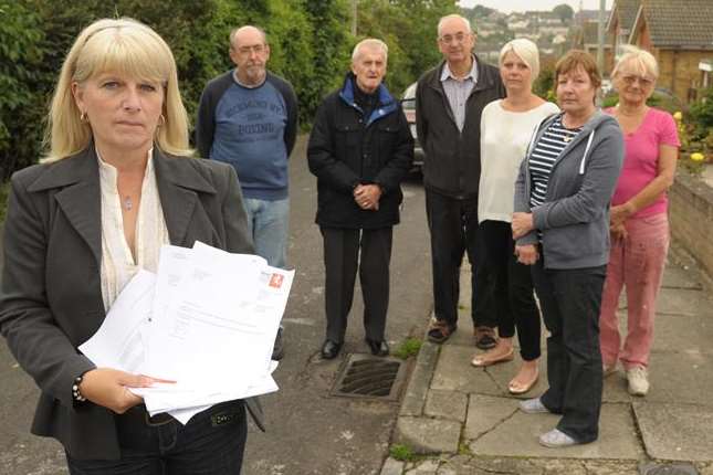 Campaigner Tina Brooker with letters to the council and angry residents