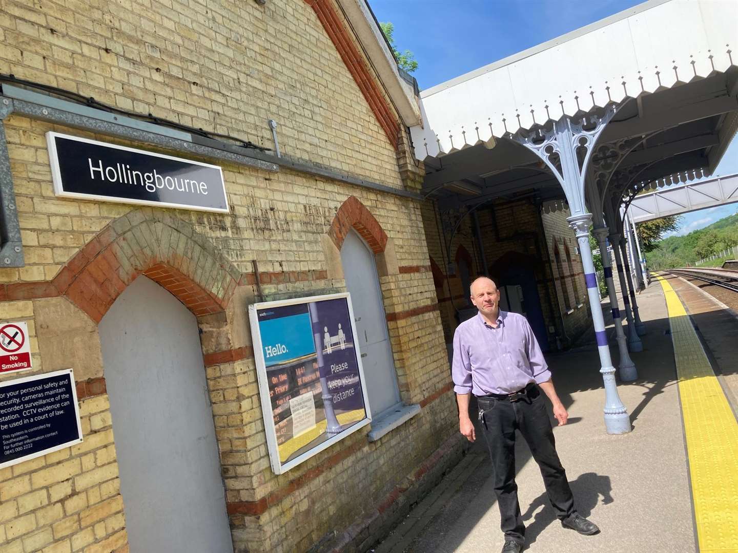 Cllr Patrik Garten by the restored building