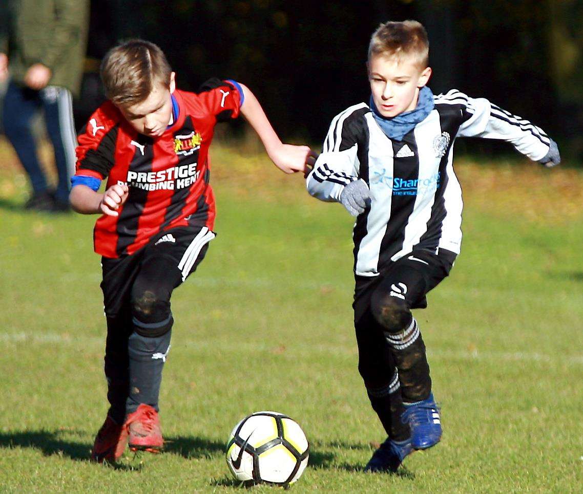 Woodcoombe Youth under-10s, left, go head-to-head with Real 60 Lions Picture: Phil Lee