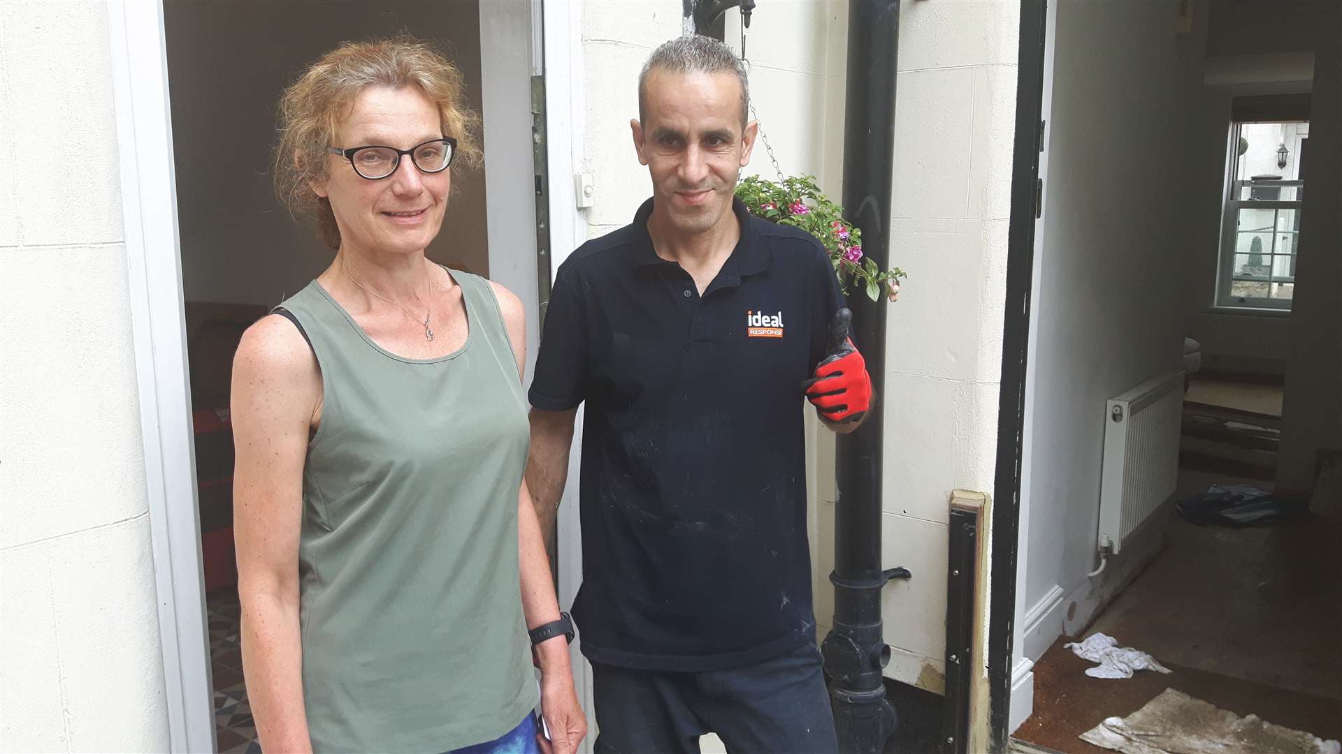 Annette Pantall with Toufik Bourfine who was working to clear up the flooded properties