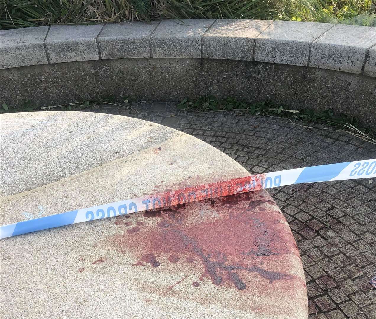 Blood and police tape seen close to the bandstand on The Leas in Folkestone