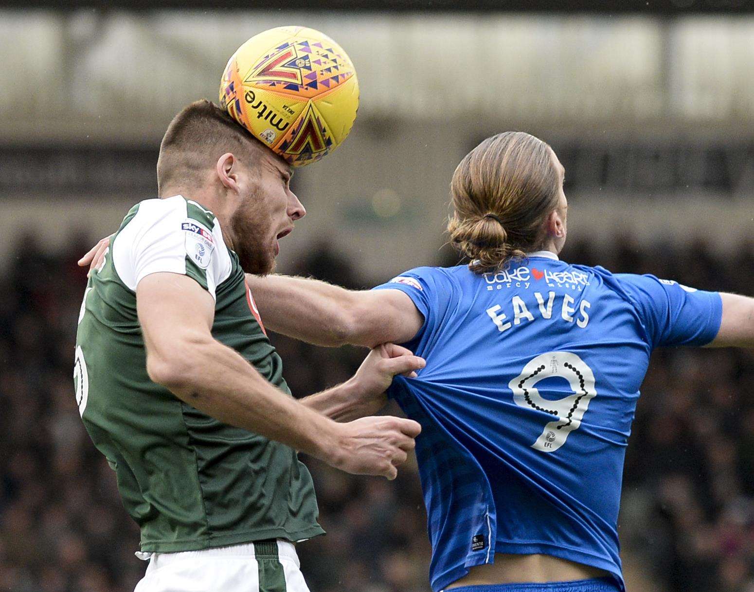 Gillingham's Tom Eaves against Plymouth's Ryan Edwards at Home Park, in December. Picture: Ady Kerry