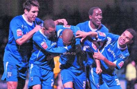 Simeon Jackson is mobbed by team-mates after his injury-time penalty winner. Picture: Matthew Reading