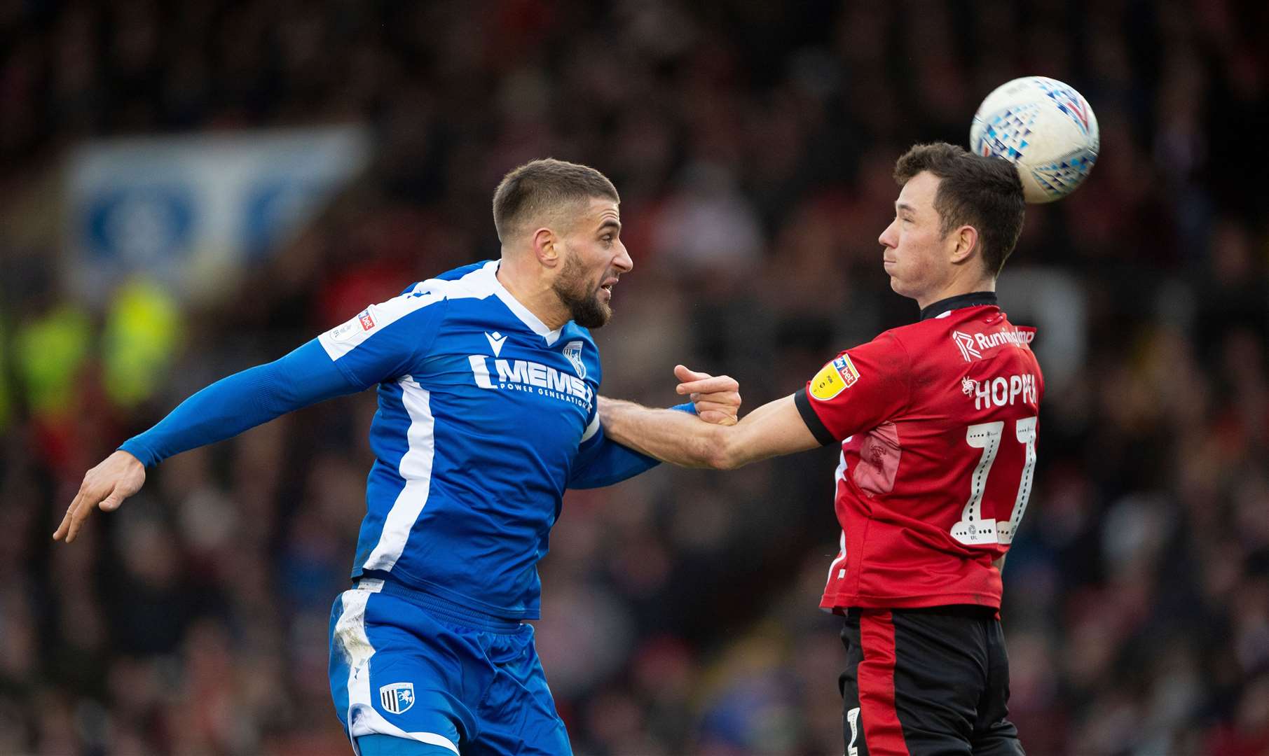 Max Ehmer heads on under pressure from Tom Hopper against Lincoln City last season Picture: Ady Kerry