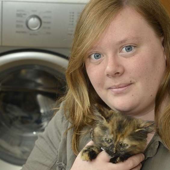 Lauren Gavin with her miracle kitten Gollum, who survived a full cycle in her washing machine