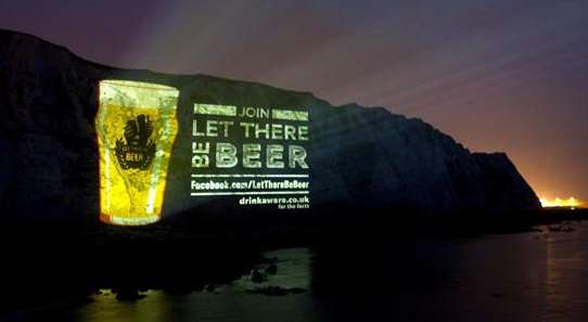 A picture of a pint is projected on to the White Cliffs