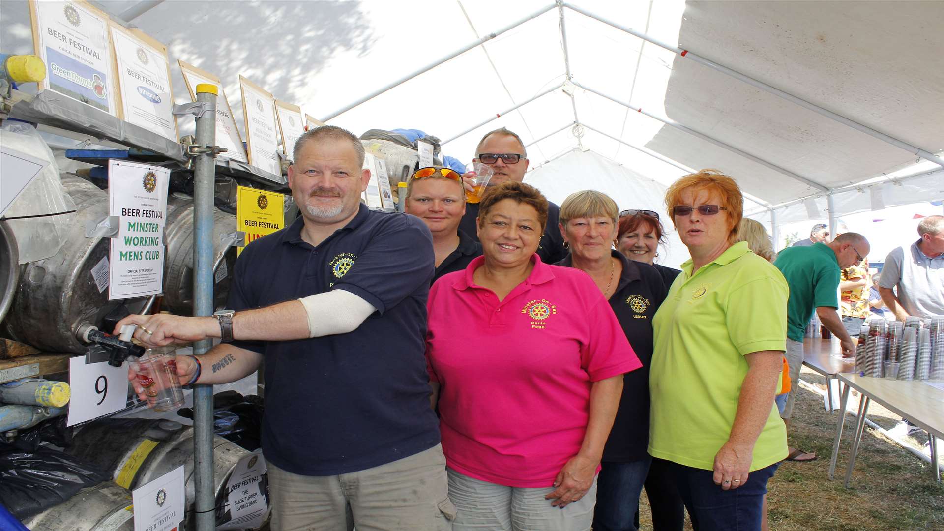 Rotary president Phil Chislett and fellow members served beers at the annual festival