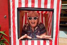 Linda Lewis tries out a puppet booth