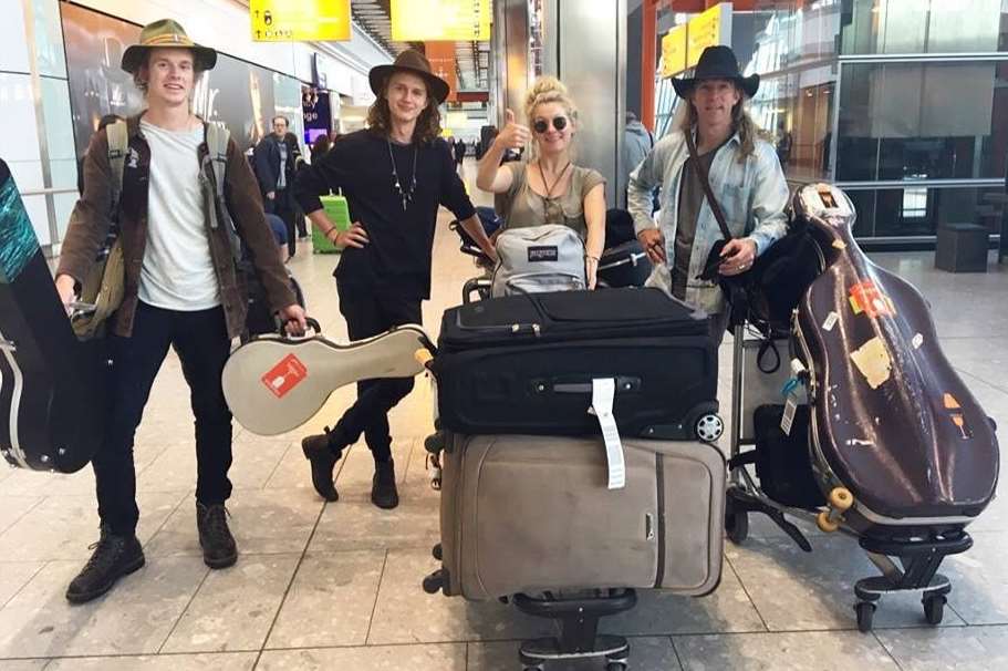 The band arriving at Heathrow