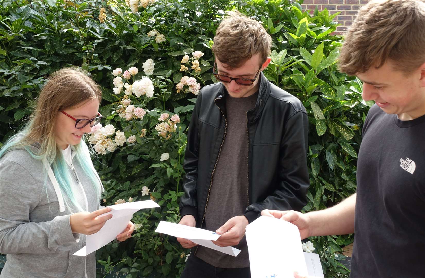From left, Ela Mazurek, Toby Short and Joe Crossley with their A-level results at The Sittingbourne School