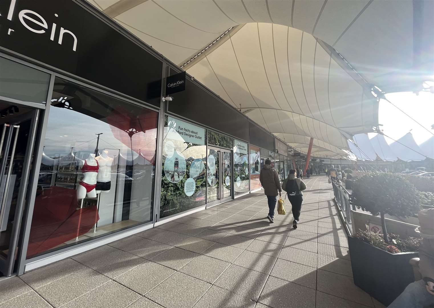 Changes have been brought in for staff at Ashford Designer Outlet to leave their cars in the main car park after 5pm at weekends only, which some say does not go far enough to protect staff over security concerns