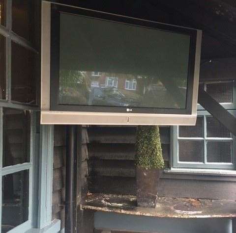 It wasn’t on but there was a decent sized TV screen in one corner of the covered area out back