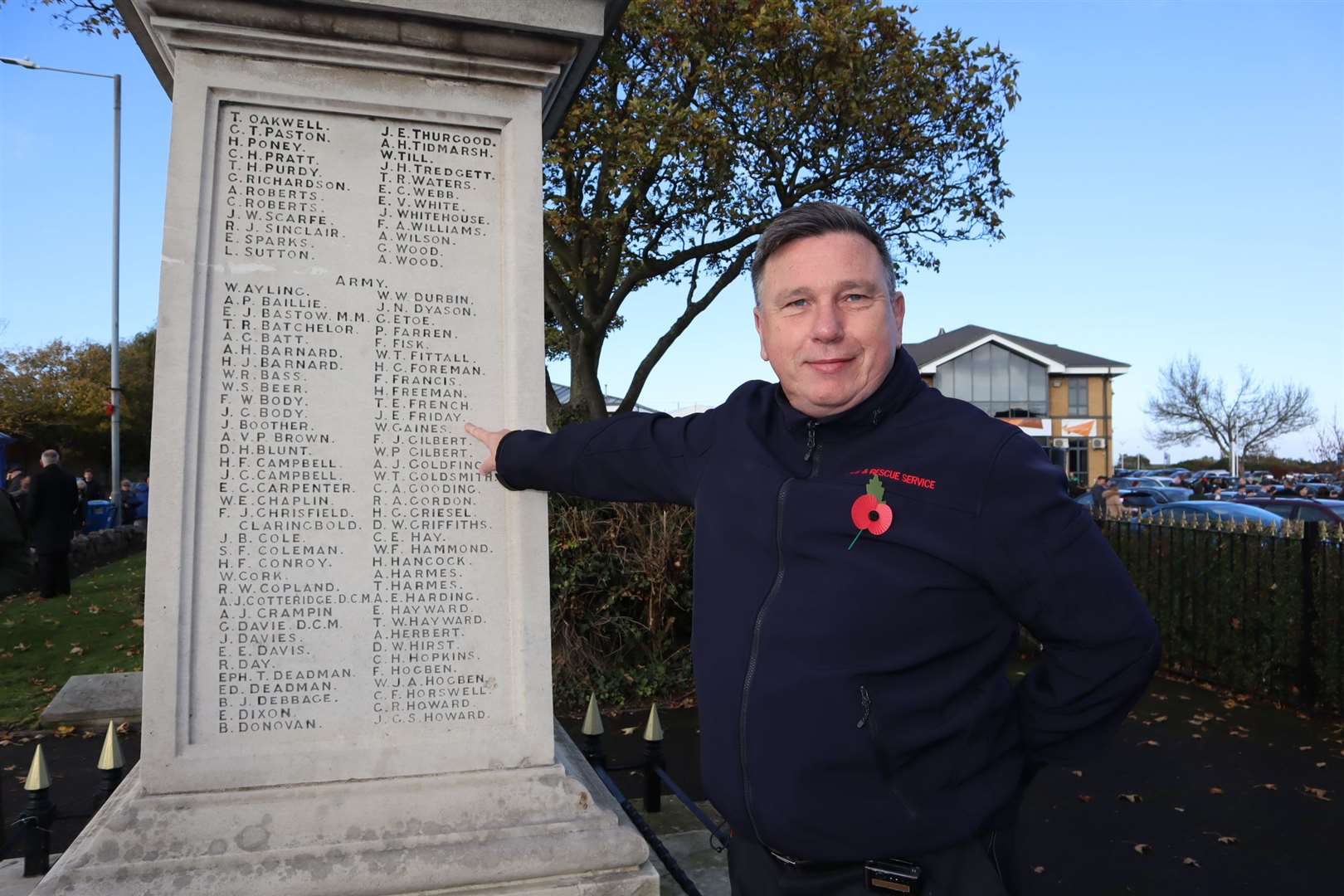 Andy Friday, crew manager of Kent Fire and Rescue's Sheerness station points out his grandfather John Edward Friday on Sheerness war memorial during the Remembrance Sunday service (21306148)