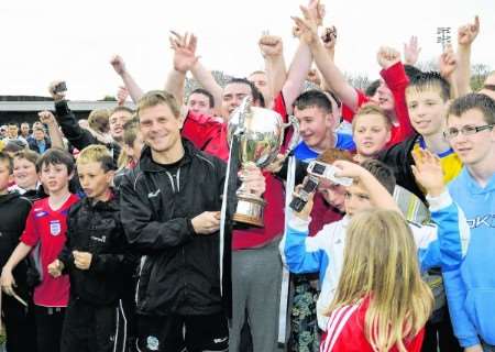 Dover boss Andy Hessenthaler shows off the league trophy to the club's fans Picture: Paul Amos
